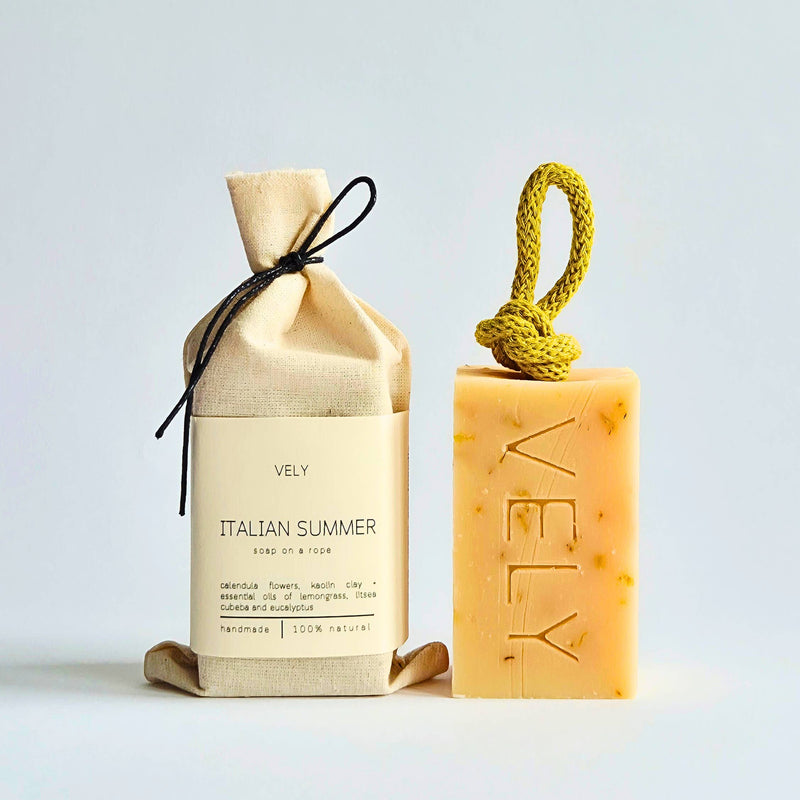 Vely Italian Summer soap bar on a rope and in cotton bag on a light gray background