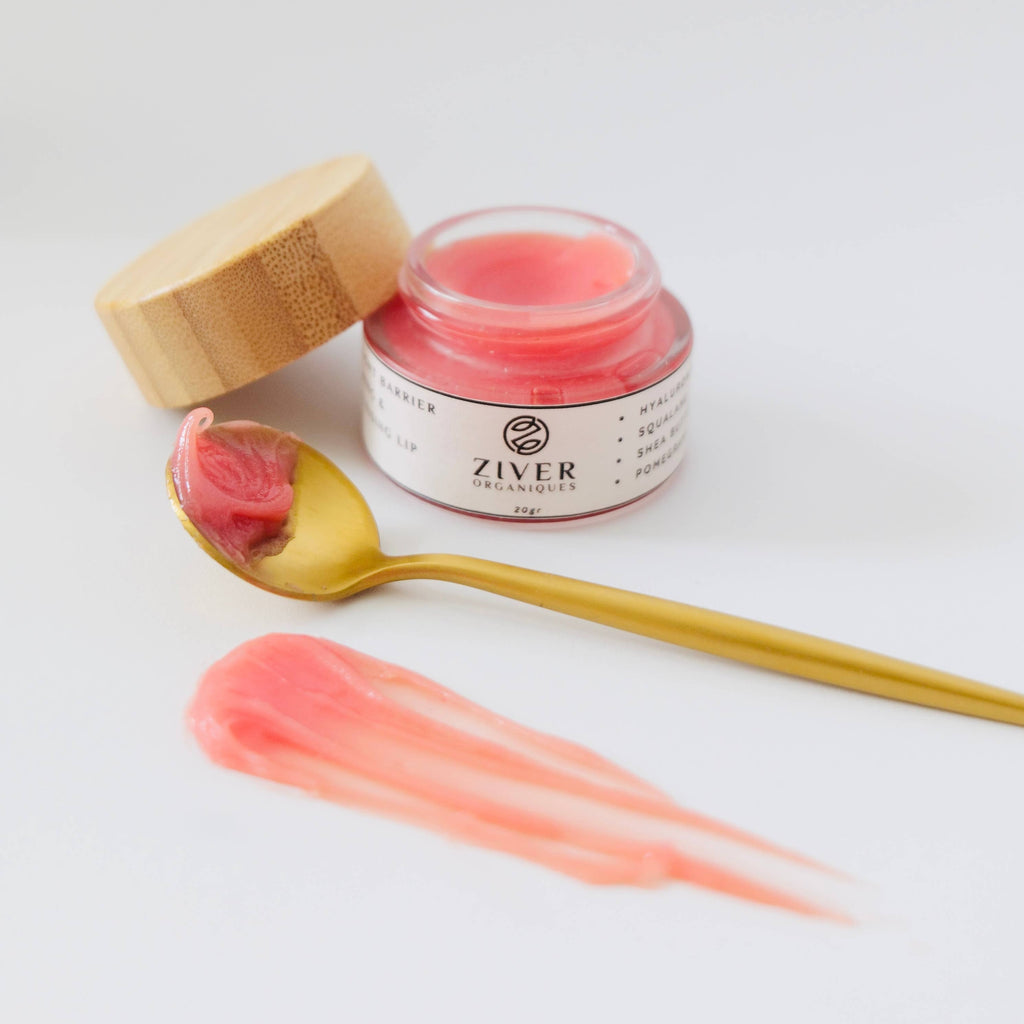 Ziver Organiques lip maks in jar with a spoonful of lip balm on a white background