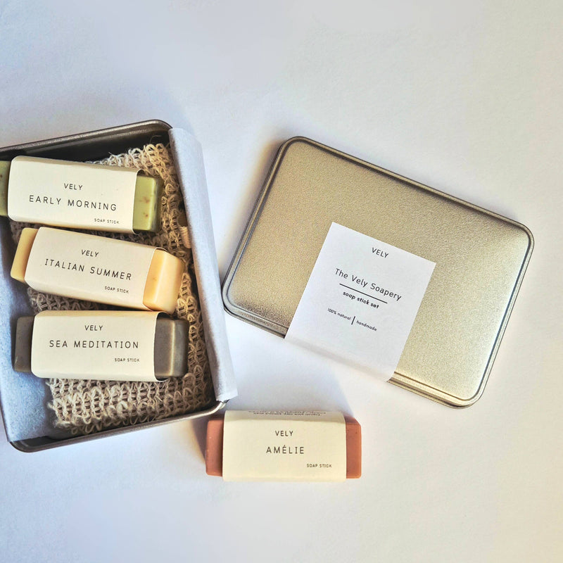 Set of 4 Vely soap bars in a tin box on a light background