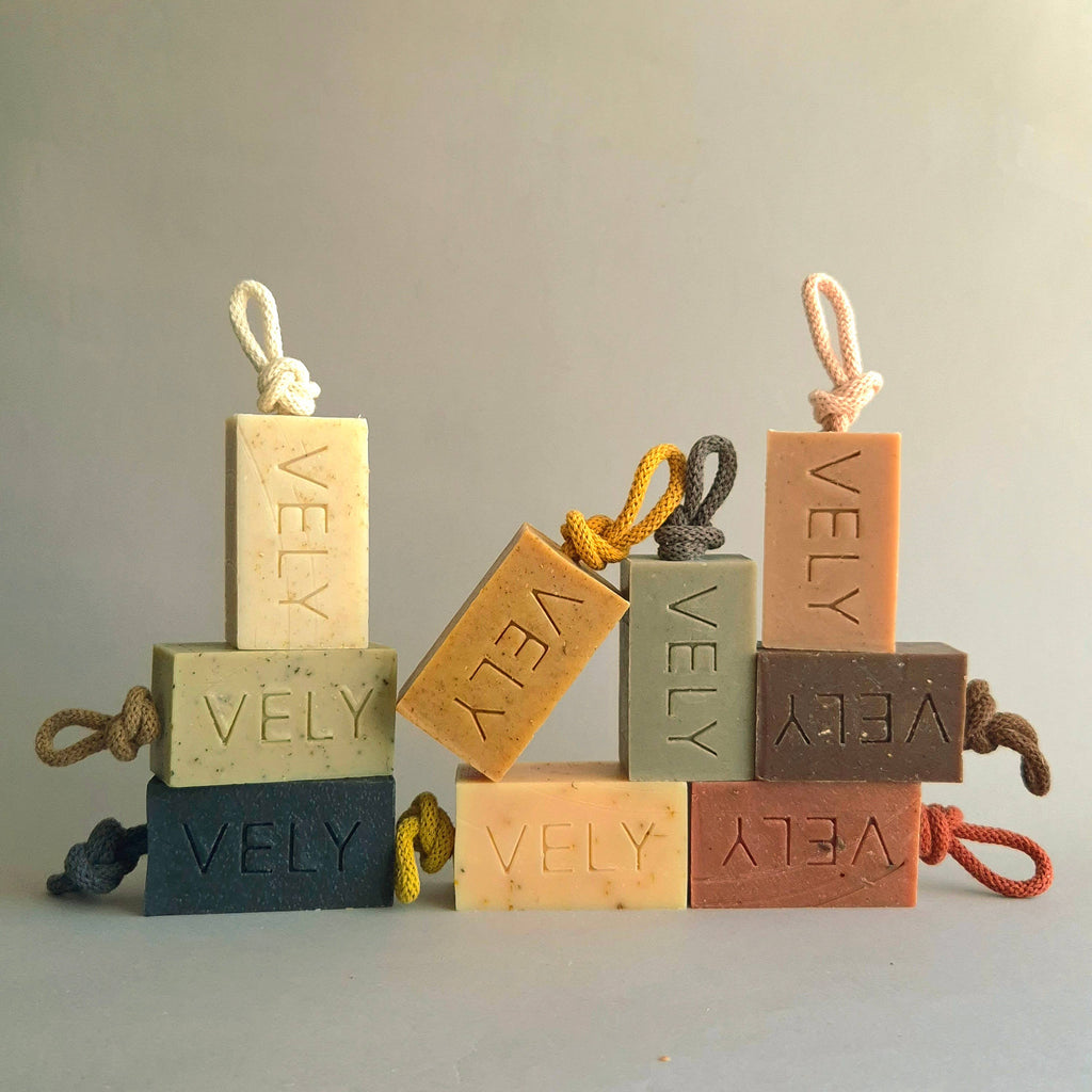 Set of VELY soap bars with ropes on a neutral background