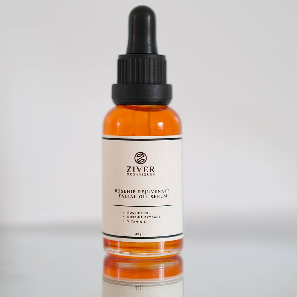 Ziver Organics facial oil serum bottle with dropper on a reflective surface.
